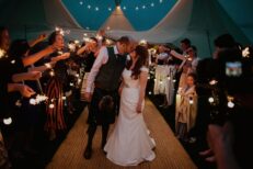 tipi festival farm wedding bride groom sparkler exit cormiston farm biggar scotland