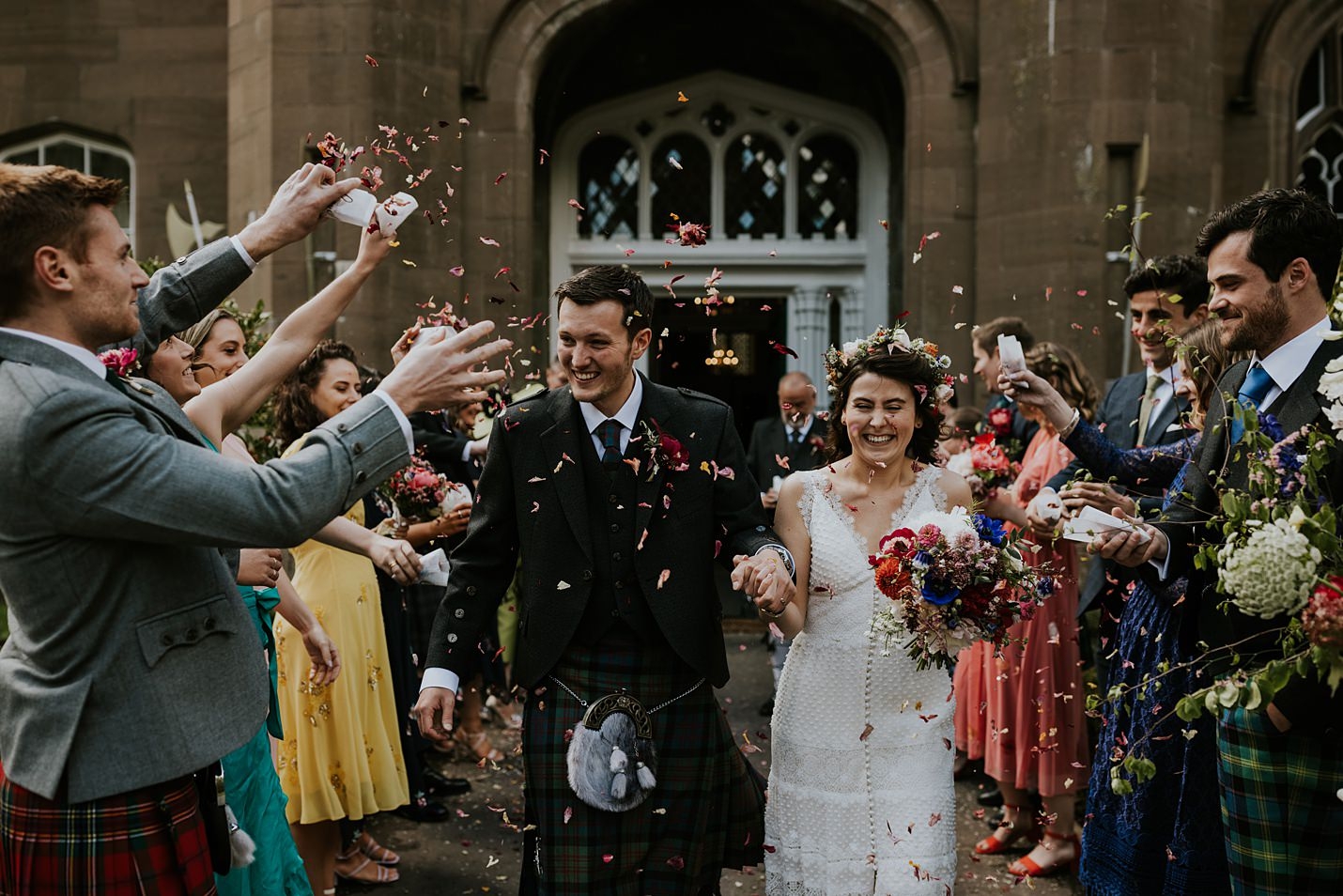 Drumtochty Castle confetti shot bride groom the flower pavilion bridal crown & colourful bouquet chiffon and lace Catherine Deane bridal gown