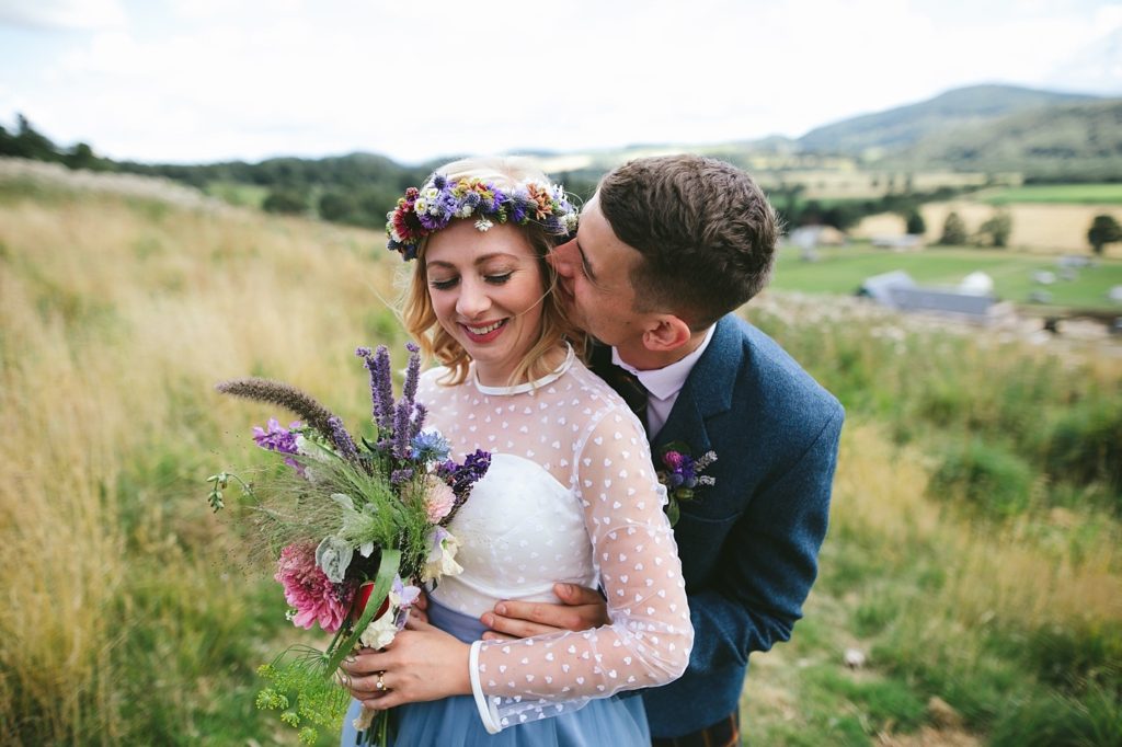 wedding at Bride and groom on their wedding day at Comrie Croft in Perthshire