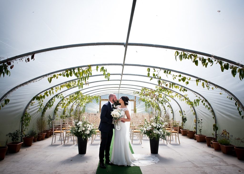 Newlywed couple in the polythenel at Colstoun House