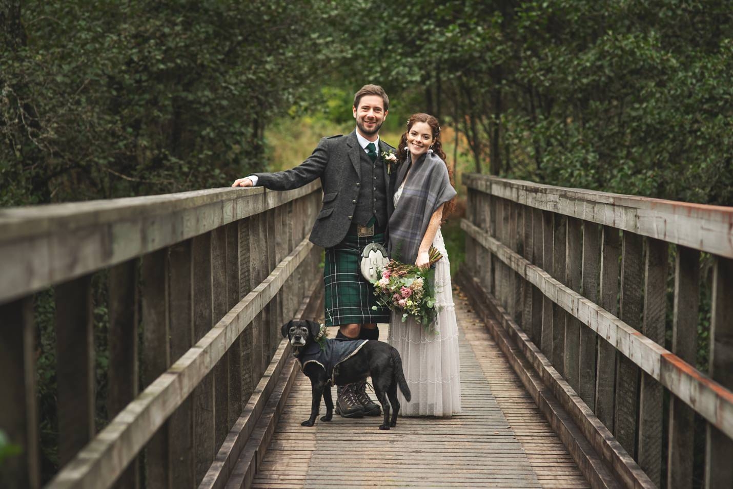 mini wedding scotland bride groom outdoor couples portraits on bridge with dog