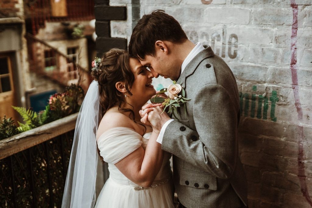 glasgow ashton lane bride groom portraits on cobbled street grosvenor cinema