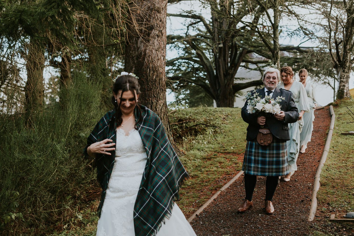 moness resort aberfeldy outdoor micro wedding bride bridesmaids walking to ceremony in birks
