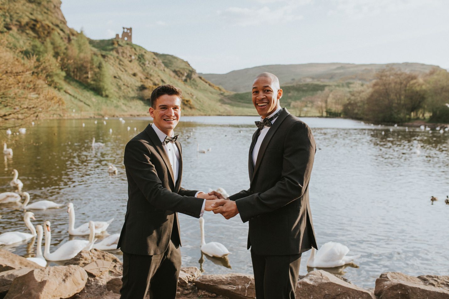 holyrood park pond edinburgh micro wedding two grooms holding hands
