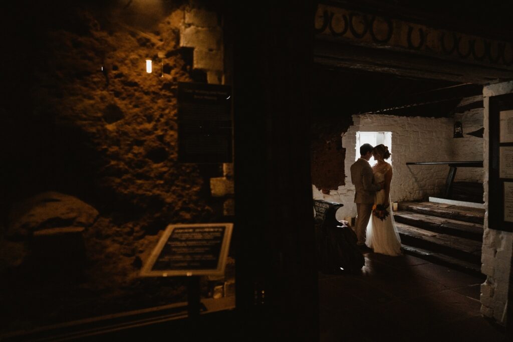 gretna green blacksmiths shop internal wedding elopement ceremony bride groom by window light