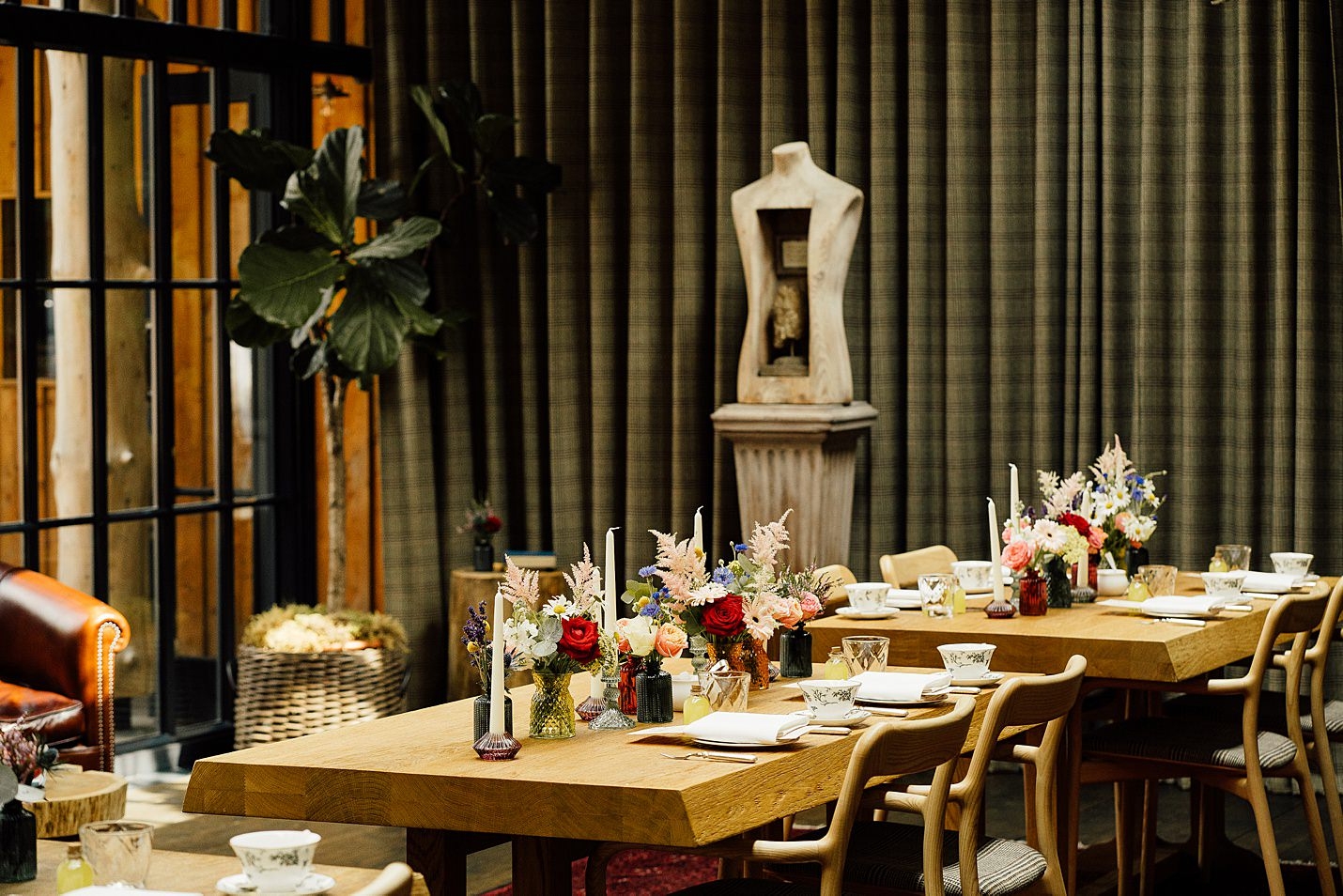 fife arms hotel braemar colourful floral table styling glass candle stick tapered candles